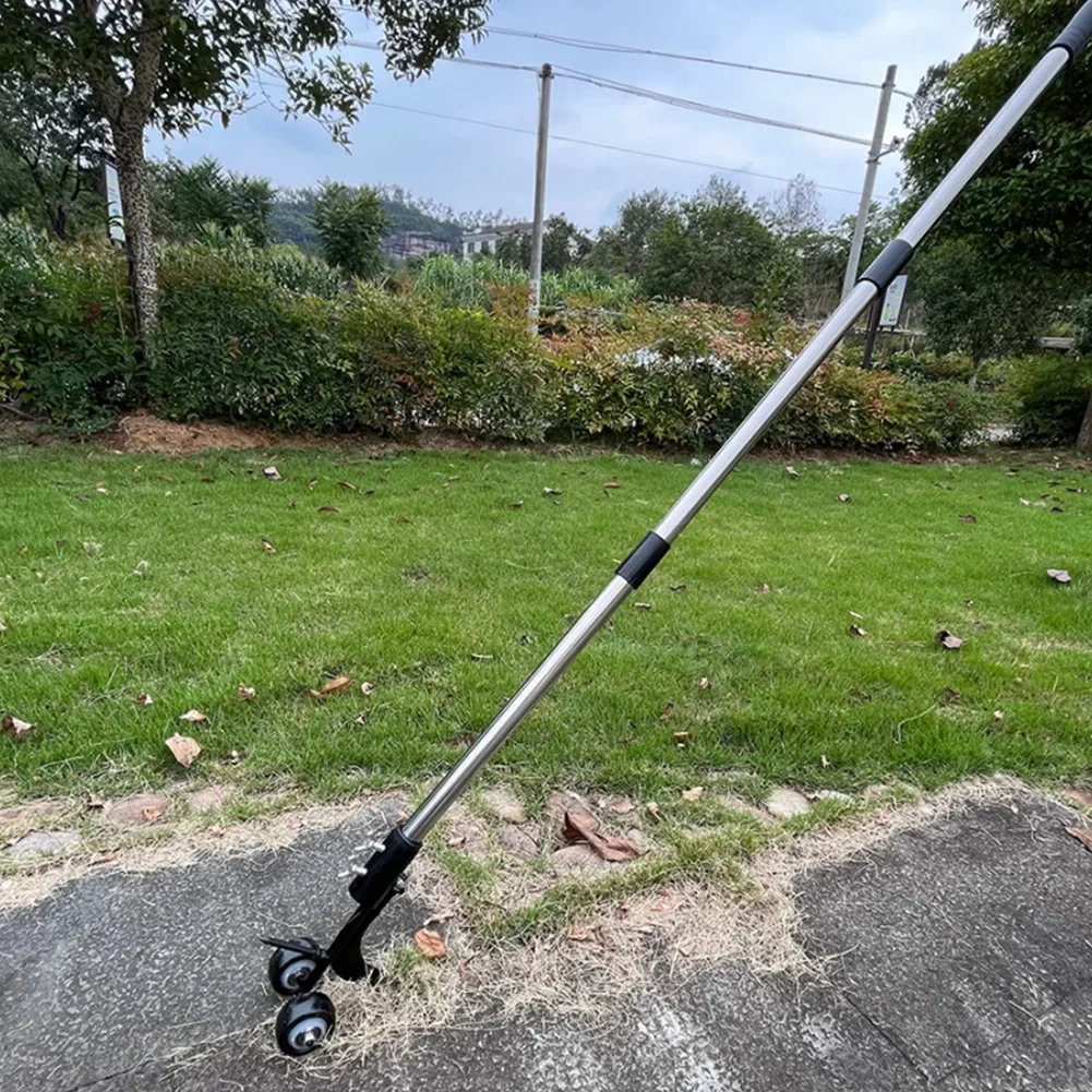 Manual weed remover tool rolling over patio crevices